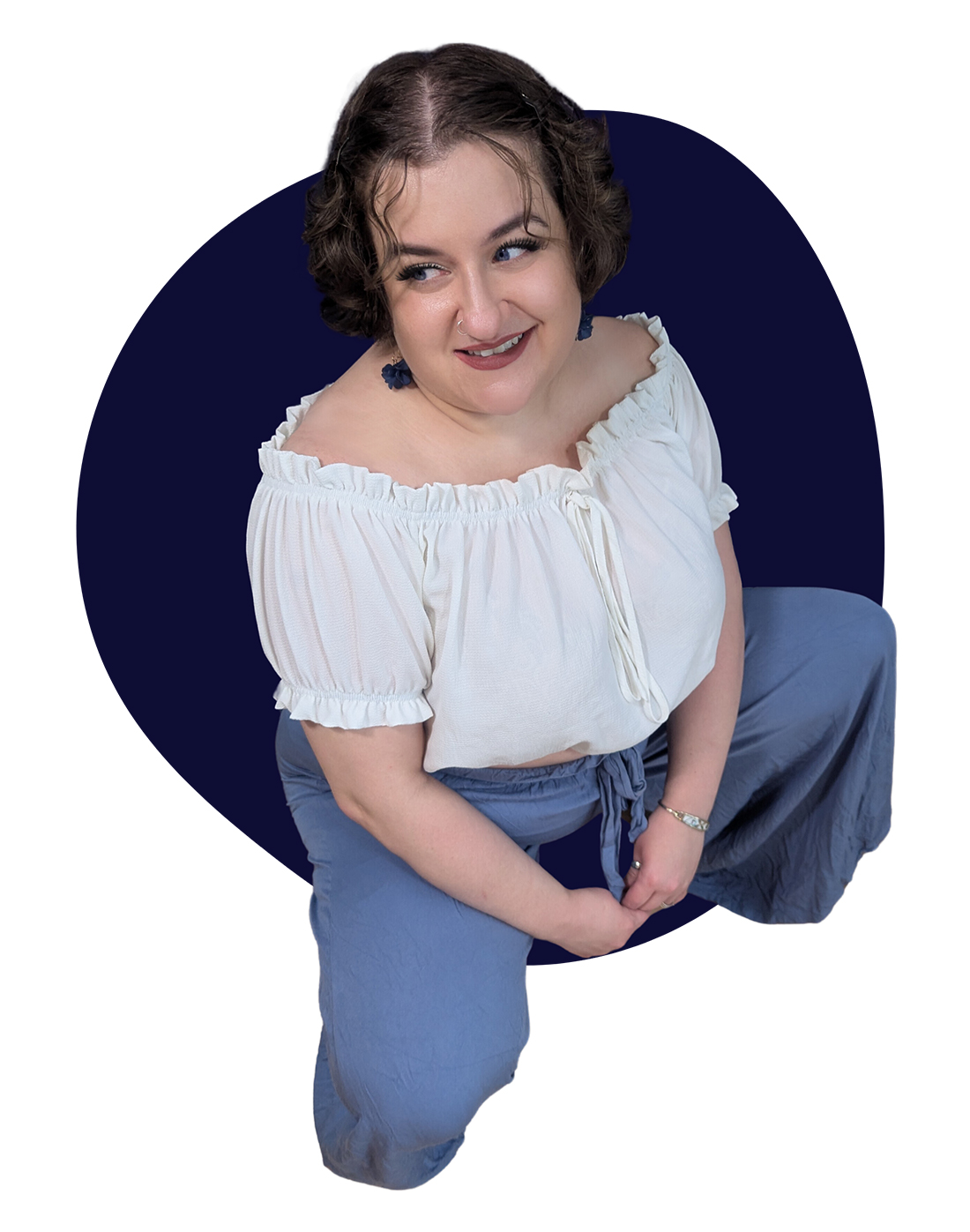 a photo of Sika squatting down and looking to the side